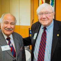 President Emeritus Don Lubbers posing with Samir Ishak at the Retiree Reception.